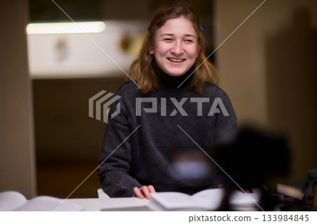 Young lady with cerebral palsy studying using technological aids, Enthusiastic woman with cerebral palsy learning with aid of modern assistive technology at bright workspace Young lady with cerebral palsy studying using technological aids, Enthusiastic woman with cerebral palsy learning with aid of modern assistive technology at bright workspace 133984845