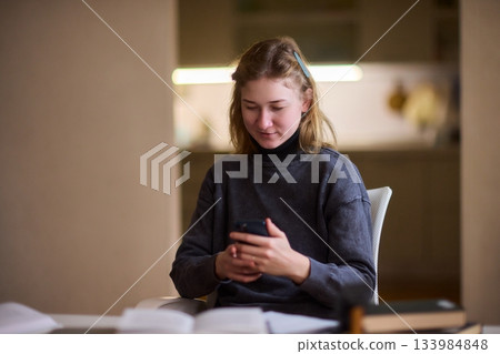 Young lady with cerebral palsy studying using technological aids, Enthusiastic woman with cerebral palsy learning with aid of modern assistive technology at bright workspace Young lady with cerebral palsy studying using technological aids, Enthusiastic woman with cerebral palsy learning with aid of modern assistive technology at bright workspace 133984848