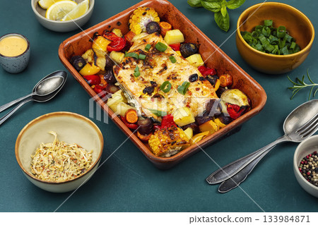 A delicious piece of salmon fried with vegetables. 133984871