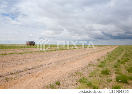Off-road vehicles in remote region of Mongolia. Gobi desert area Off-road vehicles in remote region of Mongolia. Gobi desert area 133984895