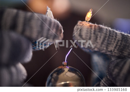 Expert carefully calibrates plasma equipment using sensitive techniques, Research professional employs meticulous methods to adjust plasma probe with expert precision 133985168