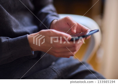 Young lady with cerebral palsy studying using technological aids, Enthusiastic woman with cerebral palsy learning with aid of modern assistive technology at bright workspace 133985194