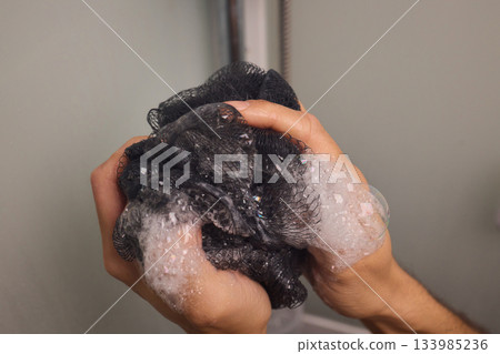 Personal grooming with warm water care, Relaxing morning shower with bubbly hair washing session, Closeup of sudsy hair being gently massaged during daily cleansing 133985236