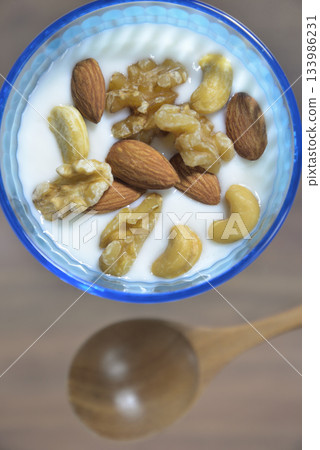 Yogurt topped with roasted mixed nuts Yogurt topped with roasted mixed nuts 133986231