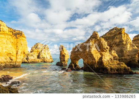 Ponta da Piedade Arches, Rock Formations and Atlantic Ocean on Sunny Day. Algarve, Portugal Ponta da Piedade Arches, Rock Formations and Atlantic Ocean on Sunny Day. Algarve, Portugal 133986265