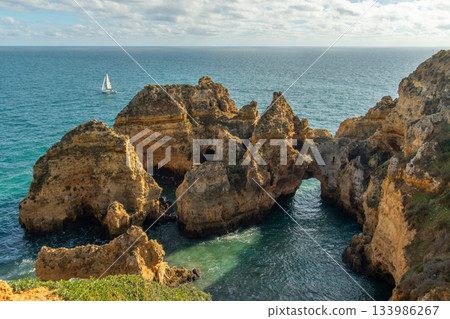 Ponta da Piedade Arches, Rock Formations and Atlantic Ocean on Sunny Day. Algarve, Portugal Ponta da Piedade Arches, Rock Formations and Atlantic Ocean on Sunny Day. Algarve, Portugal 133986267