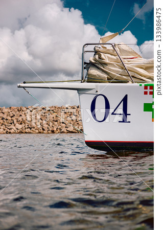 bow of a sailing boat with bowsprit at sailing regatta in the Gulf of Finland at sunny day, sailing yacht competing in a race, splashing water from under the boat, teamwork, board the boat bow of a sailing boat with bowsprit at sailing regatta in the Gulf of Finland at sunny day, sailing yacht competing in a race, splashing water from under the boat, teamwork, board the boat 133986475
