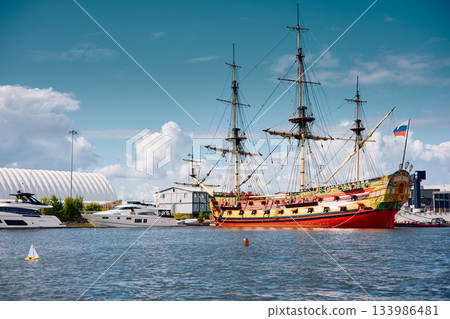 replica of a huge antique wooden frigate, thick ropes, reflections in the glossy sides of boats, huge masts replica of a huge antique wooden frigate, thick ropes, reflections in the glossy sides of boats, huge masts 133986481
