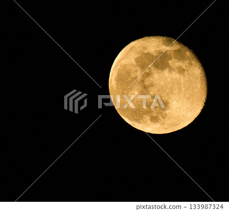 Moon shining in the night sky 133987324