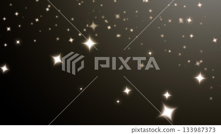 Gold luminous star effect on black background 133987373