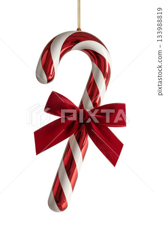 Shiny red and white candy cane styled christmas ornament, tied with classic red bow, isolated on transparent background Shiny red and white candy cane styled christmas ornament, tied with classic red bow, isolated on transparent background 133988819