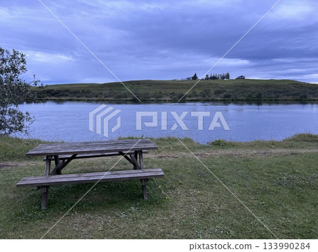 This is a view of the Ituri Langå River, which flows through the town of Hella in the south of Iceland, from a cottage camping spot. This is a view of the Ituri Langå River, which flows through the town of Hella in the south of Iceland, from a cottage camping spot. 133990284