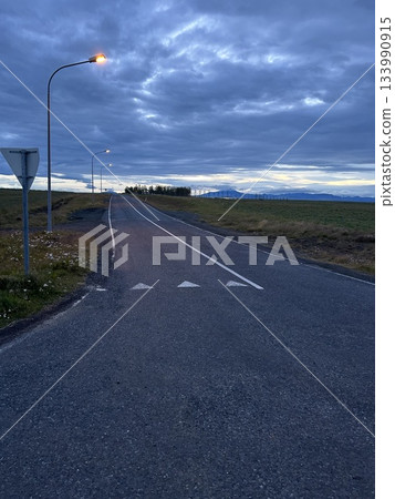 This is a morning view of a road passing through Hella, a town in southern Iceland. This is a morning view of a road passing through Hella, a town in southern Iceland. 133990915
