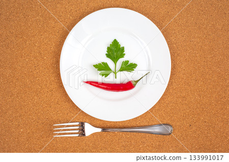 Fresh red hot peppers on a white plate. Vitamin wholesome food. Fresh red hot peppers on a white plate. Vitamin wholesome food. 133991017