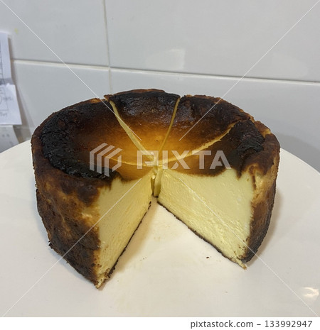 Rich and creamy burnt cheesecake with a caramelized top and a soft, velvety center. A perfect balance of deep, toasty flavor and smooth texture for an indulgent dessert. Rich and creamy burnt cheesecake with a caramelized top and a soft, velvety center. A perfect balance of deep, toasty flavor and smooth texture for an indulgent dessert. 133992947