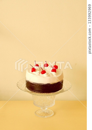 A delicious, fluffy cake with layers of rich flavor, perfect for any occasion. Often topped with frosting or fresh fruits, it's a sweet treat that brings joy to every bite. 133992969