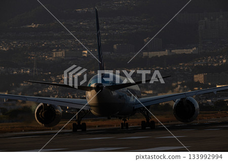 ANA passenger plane sunset ANA passenger plane sunset 133992994