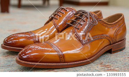 Polished brown leather men dress shoes with laces and brogue Polished brown leather men dress shoes with laces and brogue 133993555
