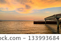 Sunset at the fishing port and calm sea 133993684