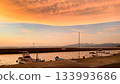 Sunset at the fishing port and calm sea 133993686
