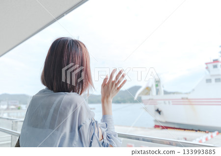 Woman and ship at the harbor Woman and ship at the harbor 133993885
