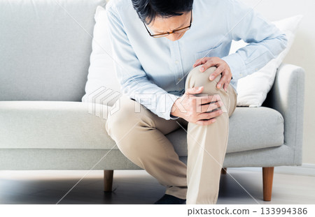 Senior man with knee pain Senior man with knee pain 133994386