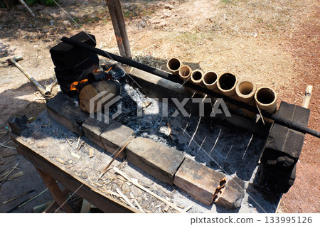 Cooking bamboo rice, a Cambodian specialty Cooking bamboo rice, a Cambodian specialty 133995126