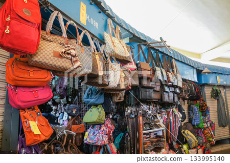A large number of bags for sale in a market in Cambodia 133995140
