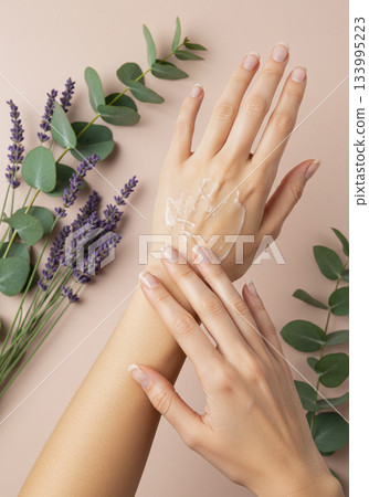 Overhead View of Woman Applying Hand Cream with Lavender and Eucalyptus 133995223