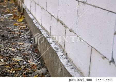 Foundation and wall.Construction of new extension from aerated concrete blocks Foundation and wall.Construction of new extension from aerated concrete blocks 133995690