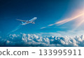A blue sky and a passenger plane flying above the clouds symbolizing hope and the future 133995911