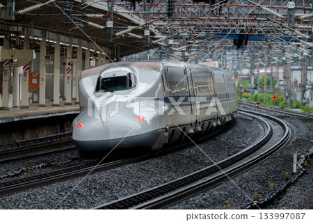 A Shinkansen train passing by Maibara Station A Shinkansen train passing by Maibara Station 133997087