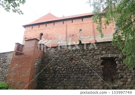 Trakai Castle under restoration on Lake Loukos Trakai Castle under restoration on Lake Loukos 133997749