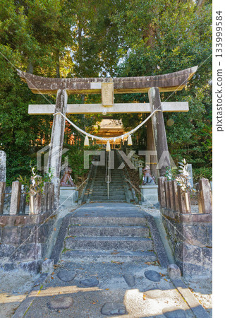 A front view of the stone torii gate and stone steps leading to Hachioji Shrine A front view of the stone torii gate and stone steps leading to Hachioji Shrine 133999584