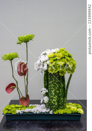 Artful flower arrangement showcasing vibrant colors and textures 133999942
