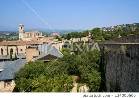 Roman wall of Girona surrounded by trees 134000606