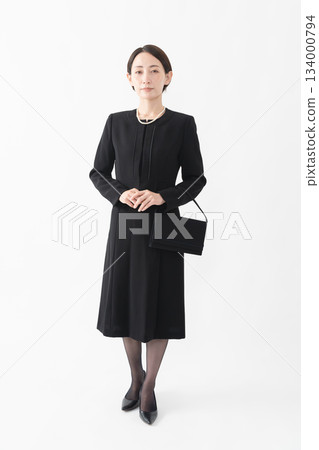 Woman in mourning clothes Funeral image 134000794
