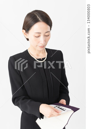 Woman in mourning clothes Funeral image Woman in mourning clothes Funeral image 134000803