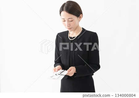 Woman in mourning clothes Funeral image Woman in mourning clothes Funeral image 134000804