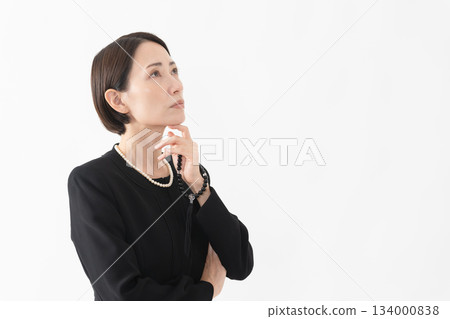 Woman in mourning clothes Funeral image 134000838