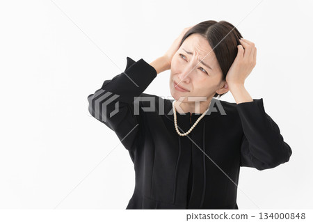 Woman in mourning clothes Funeral image 134000848