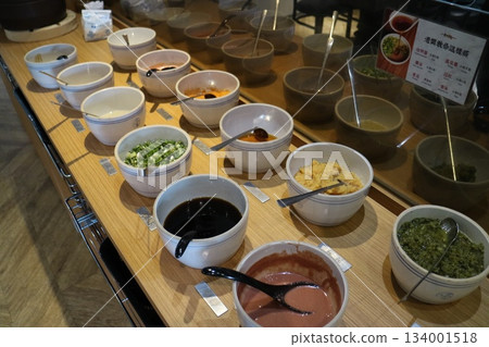 Bowl containing various seasonings and sauces 134001518