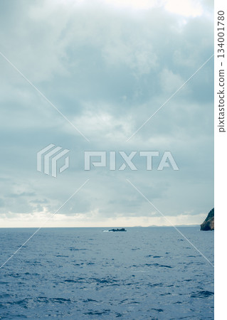 A view of the ocean and blue sky from the ferry deck 134001780