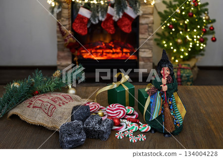 La Befana and Epiphany Italian Tradition with Fireplace, Candy and Holiday Decor La Befana and Epiphany Italian Tradition with Fireplace, Candy and Holiday Decor 134004228