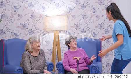 Granddaughters visiting grandmothers in nursing home for care 134004462