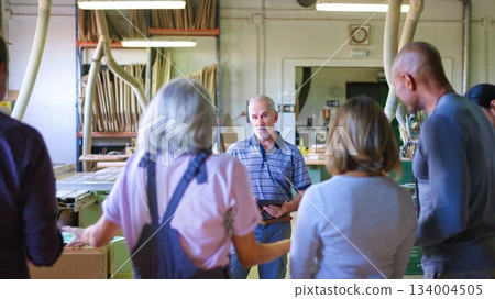 Displeased worker complaining to the boss in a factory 134004505