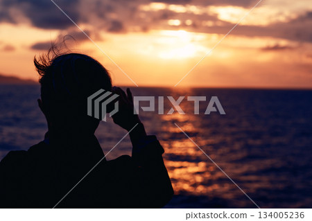A dramatic silhouette scene illuminated by strong backlighting 134005236