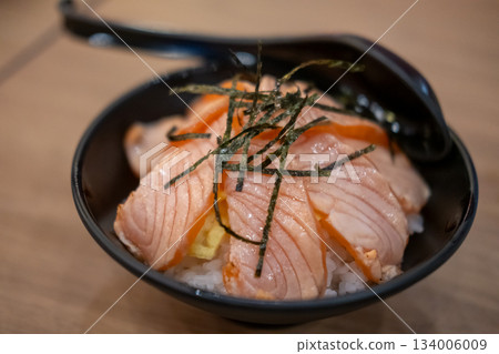 Grilled Salmon with rice, served in a bowl in the restaurant 134006009
