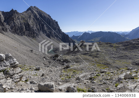 Hiking to totalp hut by totalpsee lake in ratikon mountain range 134006938