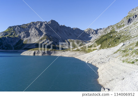Hiking to Schesaplana with view at Lunersee lake in Ratikon mountain range, Vorarlberg, Austria during a clear day Hiking to Schesaplana with view at Lunersee lake in Ratikon mountain range, Vorarlberg, Austria during a clear day 134006952